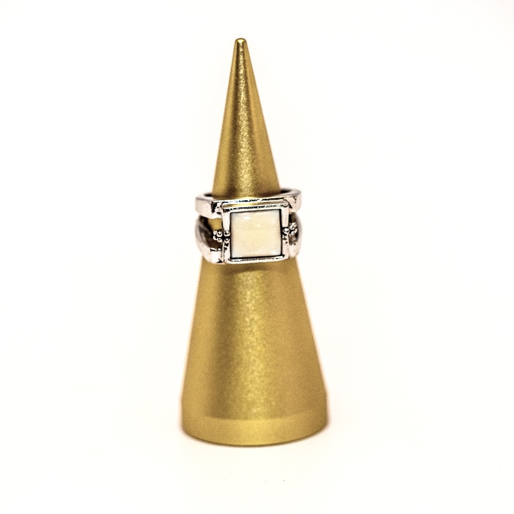Lia Sophia Silver band with white stone.